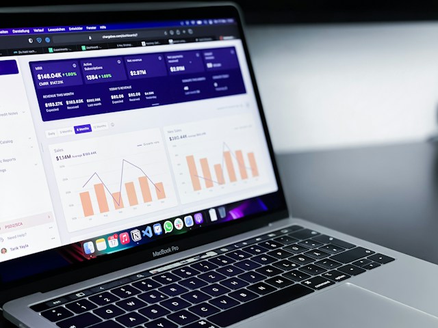 Open laptop showing a sales report dashboard